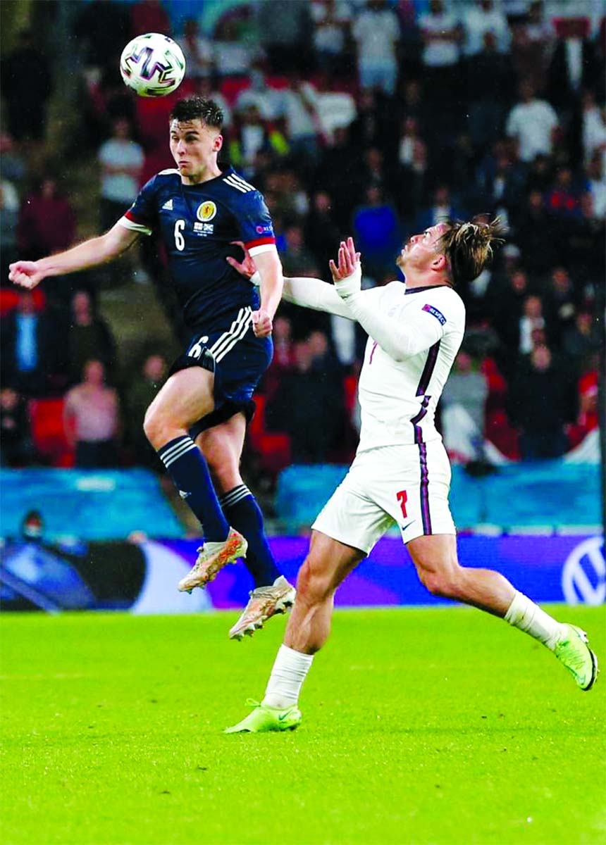 England's Jack Grealish (right) vies with Scotland's Kieran Tierney during the Group D match between England and Scotland at the UEFA Euro 2020 in London, Britain on Friday.