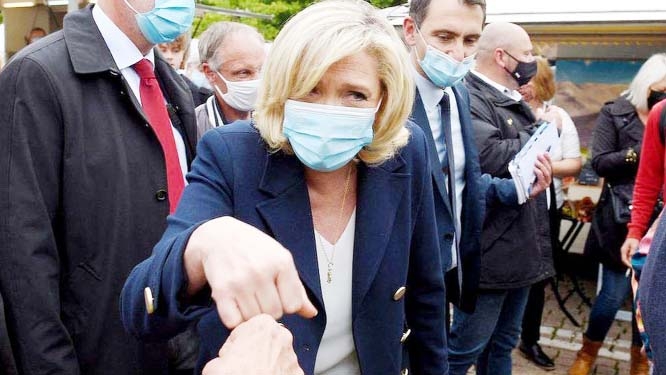 Marine Le Pen is a popular visitor as she goes on walkabout in the coastal village of Le Brusc