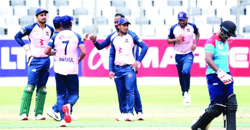 Players of Sheikh Jamal Dhanmondi Club Limited celebrating after dismissal of a wicket of Prime Bank Cricket Club in their Super League match of the Bangabandhu Dhaka Premier League Cricket at the Sher-e-Bangla National Cricket Stadium in the city's Mirp