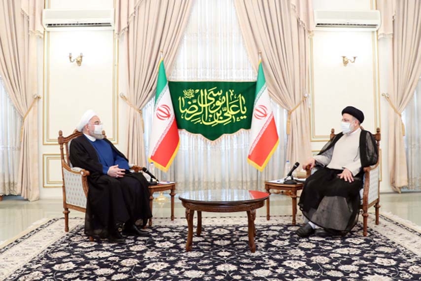 Rouhani (left) meets with Iran's President-elect Ebrahim Raisi in Tehran.