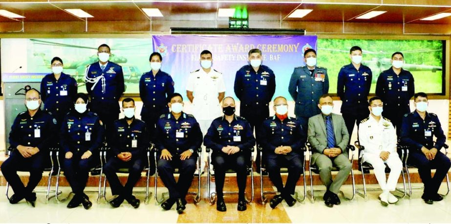 Air Chief of BAF Base Bashar Air vice-marshal Md Nazrul Islam participates at a photo session with the trainee officers who participated the course 'Search for Reason of 10th Air Craft Accident' in the capital on Sunday. ISPR photo