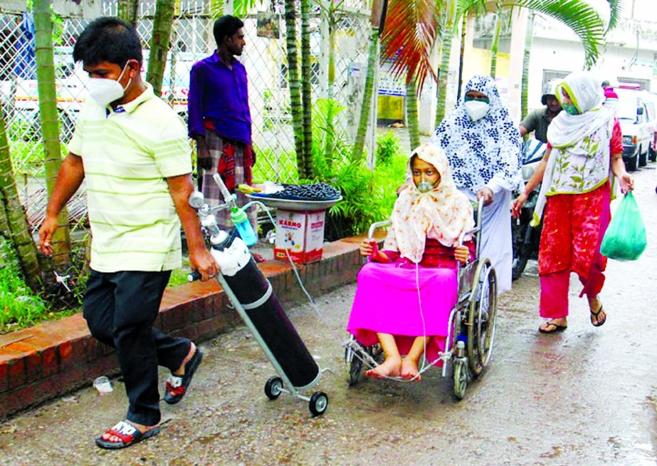 Corona positive Mim Akhtar was admitted to the ICU unit of Dhaka Medical College Hospital (DMCH) with breathing problems. She is being taken to a general bed of the hospital yesterday with oxyzen mask on her face.