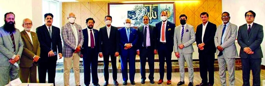 Imran Ahmed Siddiqui, Pakistan High Commissioner to Dhaka visited Dhaka Chamber of Commerce and Industry (DCCI) on Sunday. DCCI President Rizwan Rehman along with other executives of the organization, poses for a photo with the delegation team while othe