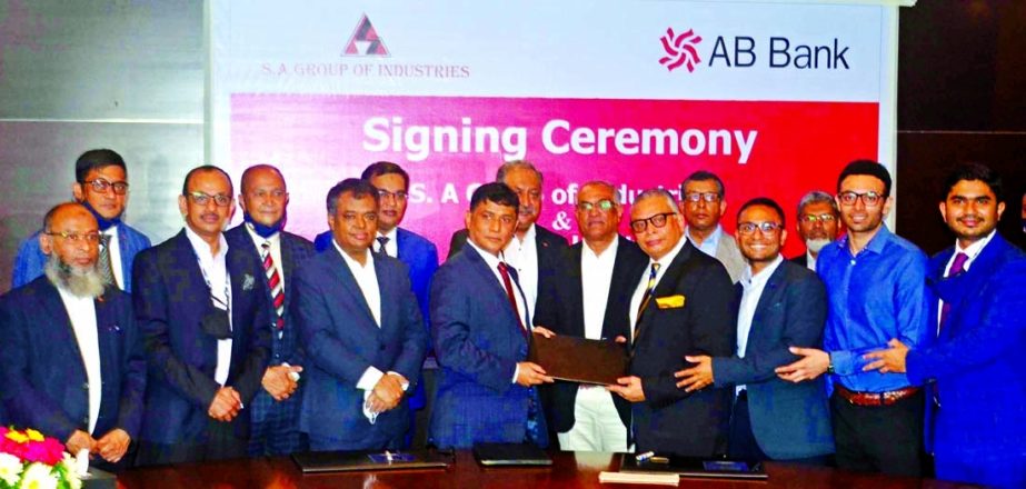 Md. Shahabuddin Alam, Chairman of S.A Group Limited and Tarik Afzal, Managing Director of AB Bank Limited, exchanging document after signing an agreement at Radison Blue in Chattogram on Monday. Under the deal, the group to collect their payment salary, b