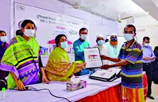 Kapasia Upazila Nirbahi Officer Mosa. Ismat Ara hands over deeds and keys of homes gifted by Prime Minister Sheikh Hasina to 12 landless families at a formal ceremony at Upazila Parishad auditorium on Sunday.