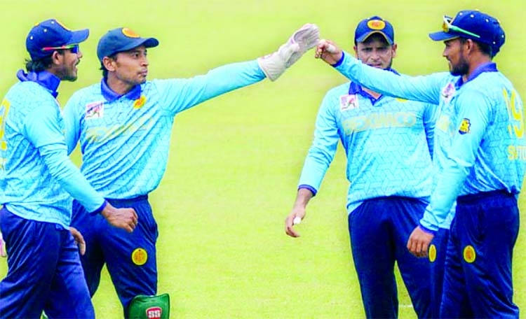 Mushfiqur Rahim (second from left) of Dhaka Abahani Limited celebrates with his teammates after dismissal of a wicket of Gazi Group Cricketers during their Super League match of the Bangabandhu Dhaka Premier League Cricket at the Sher-e-Bangla National Cr