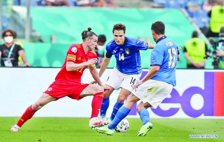 Wales' Gareth Bale (left) breaks through during the UEFA EURO 2020 Group A football match between Italy and Wales at the Olympic Stadium in Rome on Sunday.