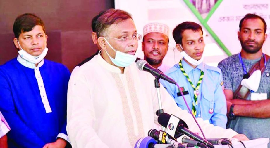 Information Minister Dr. Hasan Mahmud speaks at land and houses a handover ceremony among the beneficiaries of Betagi Bahalpur Shelter Project in Rangunia upazila of Chattogram on Sunday.