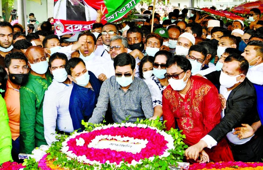 DSCC Mayor Barrister Sheikh Fazle Noor Taposh pays floral tributes at the portrait of Father of the Nation Bangabandhu Sheikh Mujibur Rahman in the city's 32, Dhanmondi on Wednesday on the occasion of the 72nd founding anniversary of Bangladesh Awami Lea