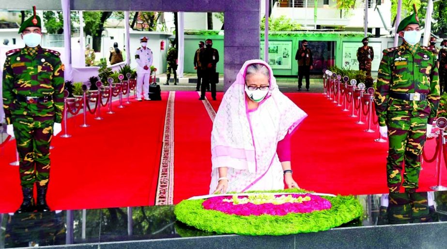 Prime Minister Sheikh Hasina places floral wreaths at the portrait of Father of the Nation Bangabandhu Sheikh Mujibur Rahman at 32, Dhanmondi in the city on Wednesday marking the 72nd founding anniversary of Bangladesh Awami League.