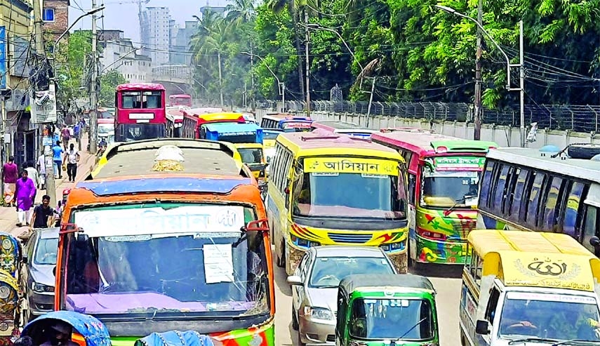 Traffic jam has become a regular phenomenon in the city following unplanned digging by the utility service providers resulting in severe waterlogging. This photo was taken from the city's Joy Kali Mondir area on Thursday.