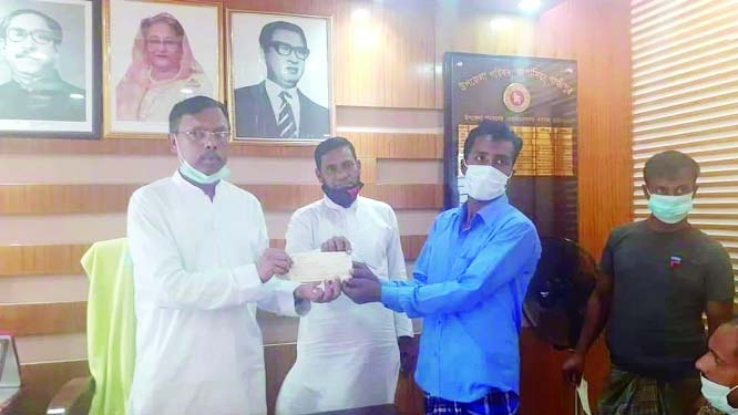 Advocate Md Amanat Hossain Khan, Chairman of Kapasia Upazila Parishad, Gazipur distributes cheques among the fire affected families in a formal ceremony held at his office on Thursday.