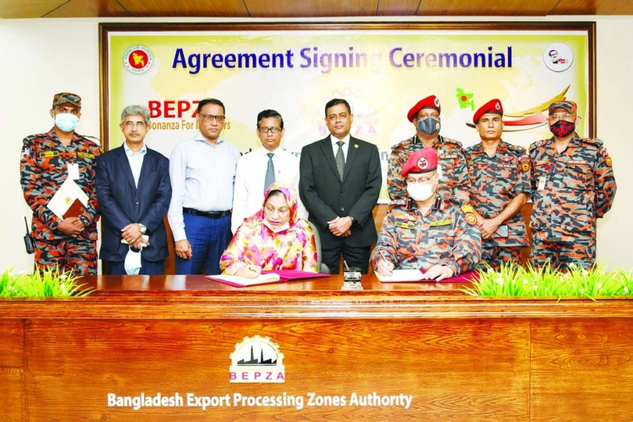 Nafisa Banu, Member (Finance) of Bangladesh Export Processing Zones Authority (BEPZA) and Lt Col Zillur Rahman, Director (Operation & Maintenance) of Fire Service & Civil Defence (FSCD), exchanging documents after signing a MoU at BEPZA Complex in the cap