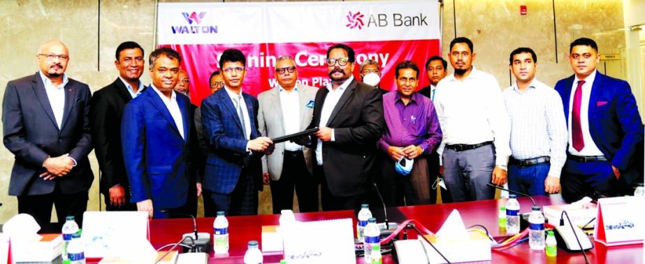 Asif Hasan, Head of Cards of AB Bank Limited and Md. Rayhan, CEO of Walton Plaza, exchanging document after signing an agreement in the capital recently. Under the deal, Credit Card holders of the bank will avail 15percent discount on Walton Fridge, AC, T