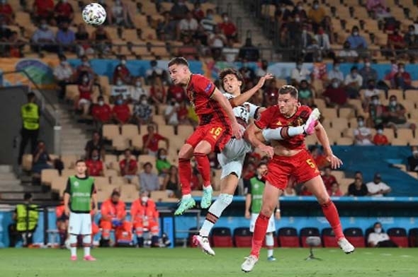 Belgium's midfielder Thorgan Hazard, Portugal's forward Joao Felix and Belgium's defender Jan Vertonghen fight for the ball during the UEFA EURO 2020 round of 16 football match between Belgium and Portugal at La Cartuja Stadium in Seville on Sunday.