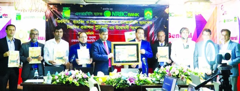 S M Parvez Tamal, Chairman of NRBC Bank Limited, unveiling the bank's quarterly publication 'PLANET', which contains financial, banking, business, technology and cultural related write-ups at a function held at the bank's head office in the capital re