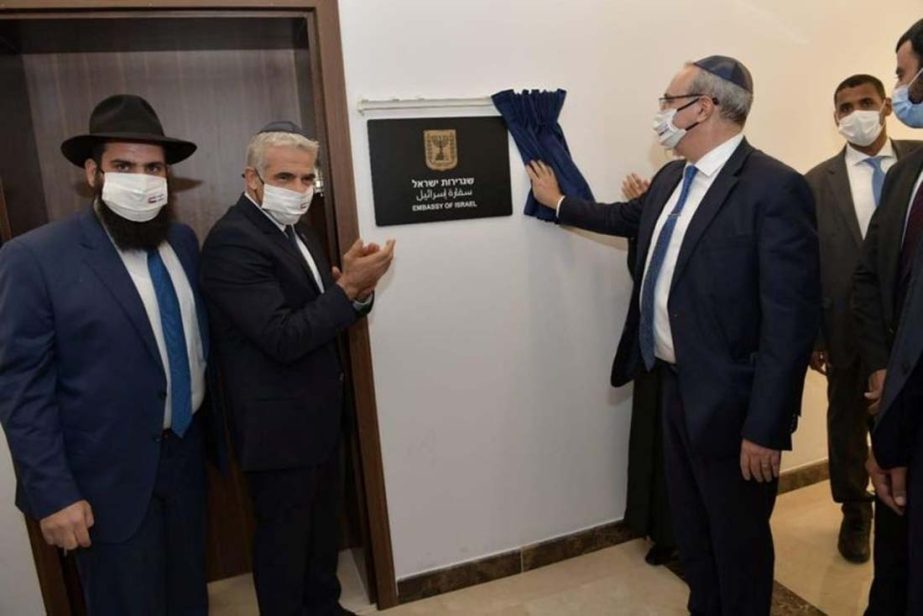 Israeli Foreign Minister Yair Lapid applauds as a plaque is revealed during an inauguration ceremony of Israel's embassy in Abu Dhabi, United Arab Emirates on Tuesday.