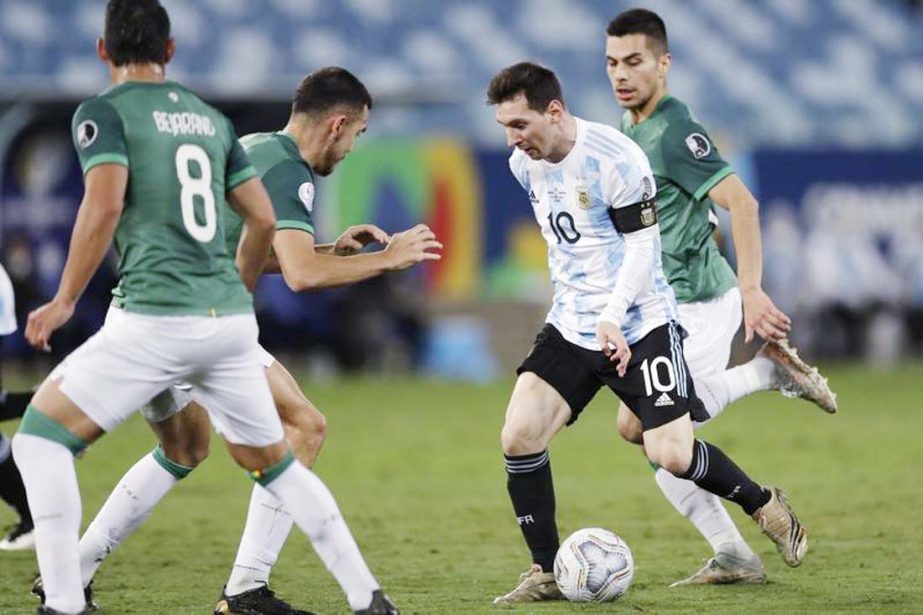 Argentina's Lionel Messi (2nd right) controls the ball during a Copa America soccer match against Bolivia at Arena Pantanal stadium in Cuiaba, Brazil on Monday.