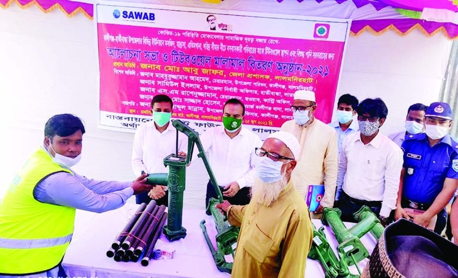 Kaliganj Upazila Executive Officer Md. Abdul Mannan, among others, attend a ceremony of distributing tube wells in 1215 places in Rangpur districts provided by Profit Foundation in the district on Monday.