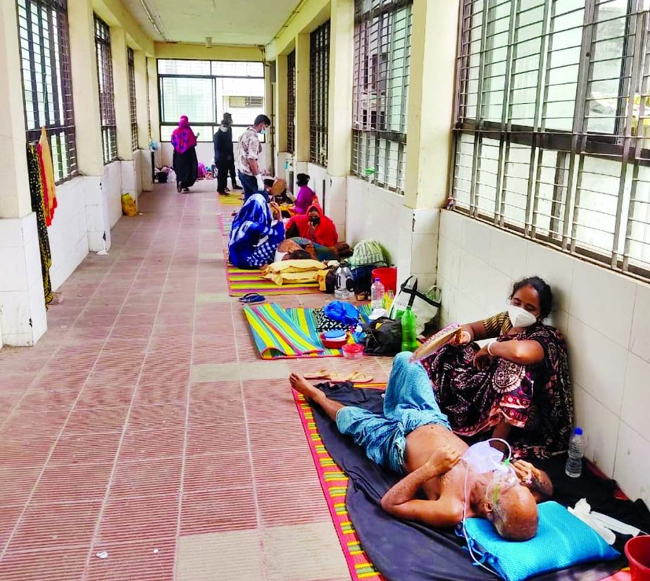Coronavirus patients lying on corridor of the Khulna Medical College Hospital on Tuesday as the public healthcare facility runs out of beds amid worsening pandemic situation in bordering districts.