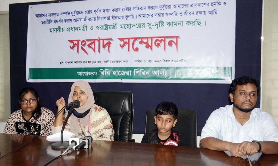 One affected Bibi Hazera Shirin Ali speaks at a prèss conference at the Jatiya Press Club on Wednesday seeking Prime Minister's interference to protect her and her families from the hands of alleged terrorists.
