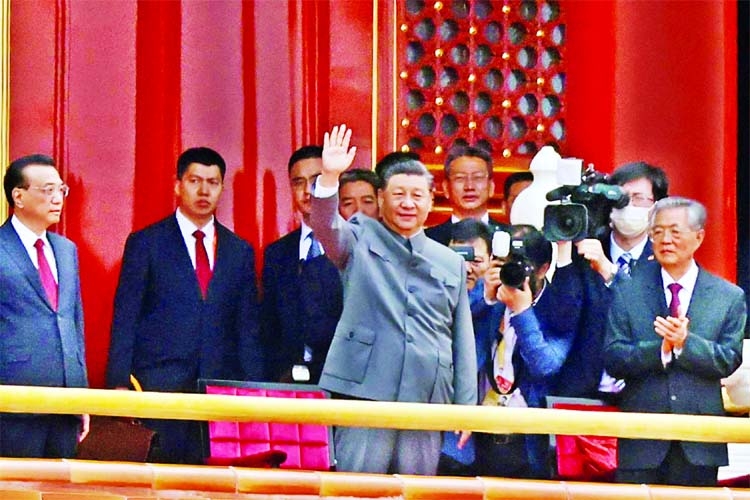 Chinese President Xi Jinping waves next to Premier Li Keqiang and former president Hu Jintao at the end of the event marking the 100th founding anniversary of the Communist Party of China, at Tiananmen Square in Beijing on Thursday.