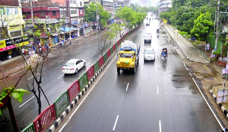 The usual busy Mirpur Road in the Dhanmondi area takes a deserted look due to absence of vehicles on the first day of 7-day strict lockdown on Thursday.