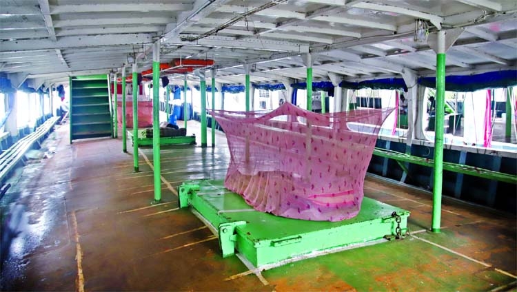 Launch staff seen to spend their time sleeping. The snap was taken from Sadarghat Launch Terminal in the city on Friday.