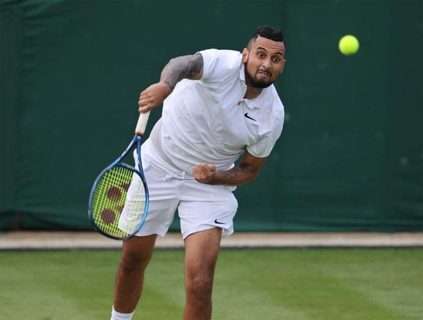 Australia's Nick Kyrgios serves to Italy's Gianluca Mager during their men's singles second round match on the fourth day of the 2021 Wimbledon Championships at The All England Tennis Club in Wimbledon, southwest London on Thursday.