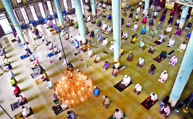 Muslim devotees performing Jumma prayer at the Baitul Mukarram National Mosque maintaining health norms on Friday.