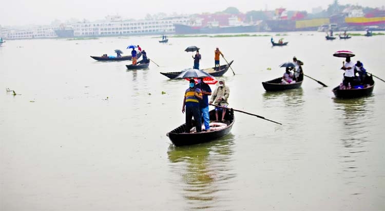 People crossing the Buriganga River by boat on Friday flouting health rules as public transports remained shut due to 7-day strict lockdown.