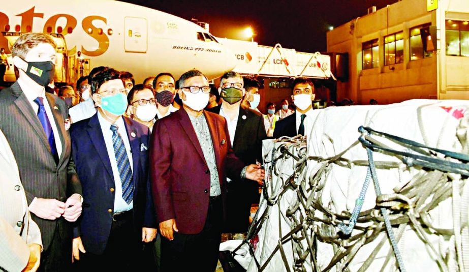 US Envoy to Bangladesh Earl Miller hands over Moderna Vaccine (first shipment) to Foreign Minister Dr. AK Abdul Momen and Health Minister Zahid Maleque at Hazrat Shahjalal International Airport in the city on Friday.