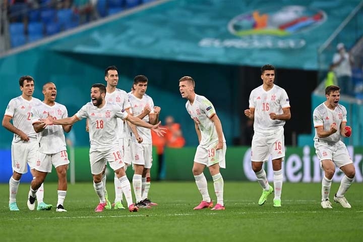 Spain's players celebrates winning the UEFA Euro 2020 quarter-final football match between Switzerland and Spain at the Saint Petersburg Stadium in Saint Petersburg on Friday.