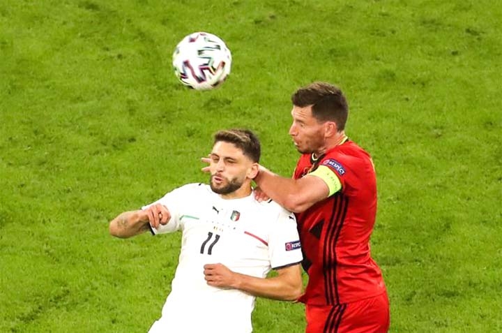 Domenico Berardi (left) of Italy vies for header with Jan Vertonghen of Belgium a UEFA Euro 2020 Championship quarterfinal match between Belgium and Italy in Munich, Germany on Friday.