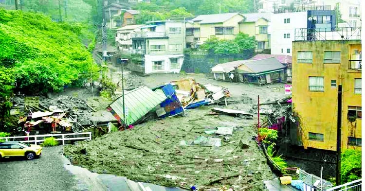 Houses are damaged by mudslide following heavy rain at Izusan district in Atami, west of Tokyo, Japan on Saturday.