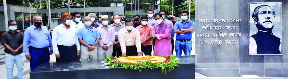 The newly-appointed Director General of Bangladesh Water Development Board Engineer Fazlur Rashid pays tribute to the portrait of the Father of the Nation Bangabandhu Sheikh Mujibur Rahman by placing a floral wreath at Dhamondi 32 No in the capital on Sun