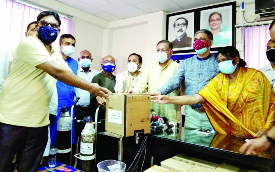 Information and Broadcasting Minister Dr Hasan Mahmud distributes Corona protective equipments for different hospitals on behalf of Relief and Social Welfare Subcommittee at the political office of Awami League President at Dhanmondi in the capital on Sun