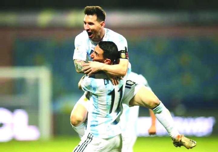 Argentina's Lionel Messi celebrates scoring their third goal with Angel Di Maria against Ecuador during their Copa America football quarter-final match at the Olympic Stadium in Goiania, Brazil on Saturday.
