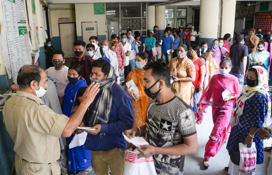 Jalandhar: People in a queue outside OPD, as they wait for general checkup at Government hospital, amid a surge in Coronavirus cases across the country. File photo