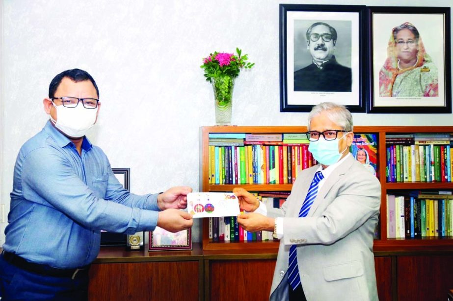 PS of Post and Telecommunication Minister Sebastin Rema hands over memorial stamp to Vice-Chancellor of Dhaka University Prof Dr. Akhtaruzzaman on Monday marking the centenary of DU.