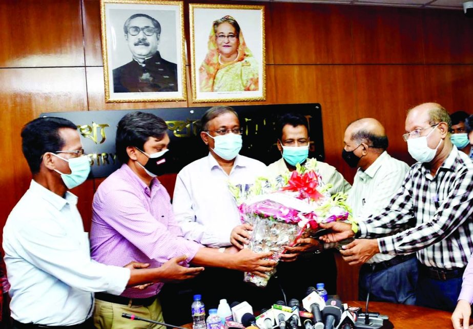 Newly elected leaders of Bangladesh Secretariat Reporters Forum greet Information and Broadcasting Minister Dr. Hasan Mahmud presenting bouquets at the seminar room of the ministry on Monday.