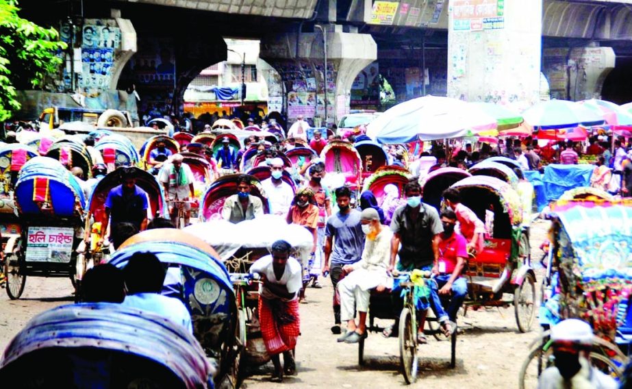 Commoners heading towards their respective destination boarding on rickshaws without maintaining health guidelines during lockdown. The snap was taken from the city's Saedabad area on Tuesday.