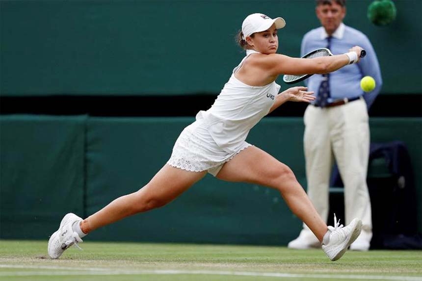 Australia's Ash Barty returns against Australia's Ajla Tomljanovic during their women's quarter-final tennis match of the 2021 Wimbledon Championships at The All England Tennis Club in Wimbledon, southwest London on Tuesday.