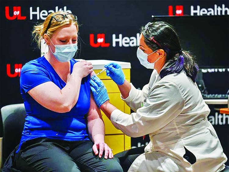 A woman gets a Covid-19 vaccine at University of Louisville Hospital, Kentucky, US.