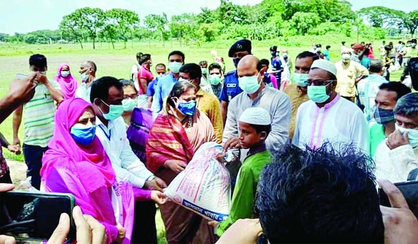 Dr. Syeda Zakia Noon Lipi, MP distributes rice, potatoes, pulse, oil, soap, mask and cash money among the jobless and destitute people on Thursday as part of the instant humanitarian support programme of the Prime Minister to mitigate the economic hardshi