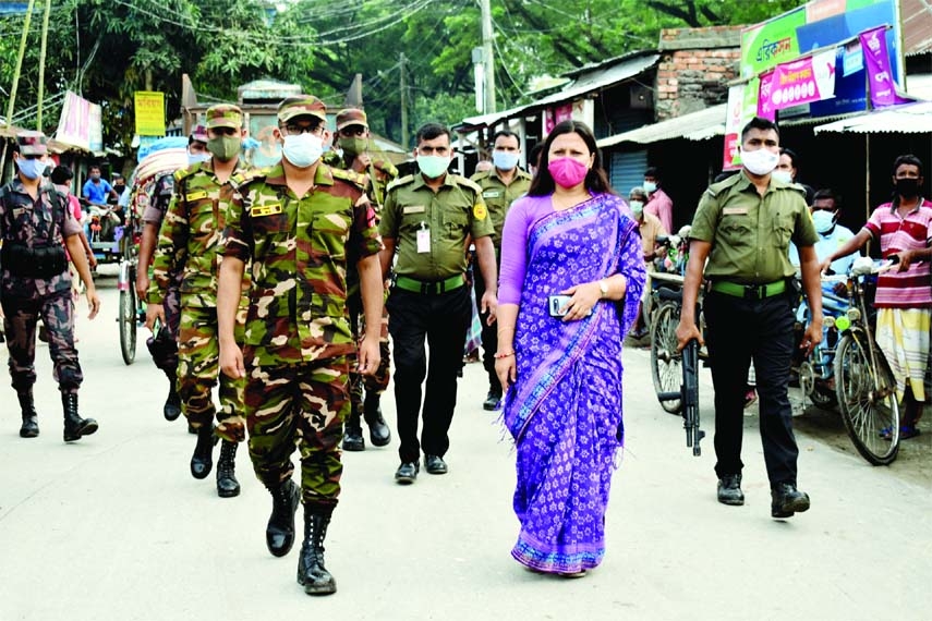 Executive magistrate and Upazila Nirbahi Officer of Bogura Gabtali Mst. Rawnak Jahan visits different places of the upazila on the 7th day of the ongoing lockdown on Wednesday to make awareness among the pedestrians regarding infection of corona virus an