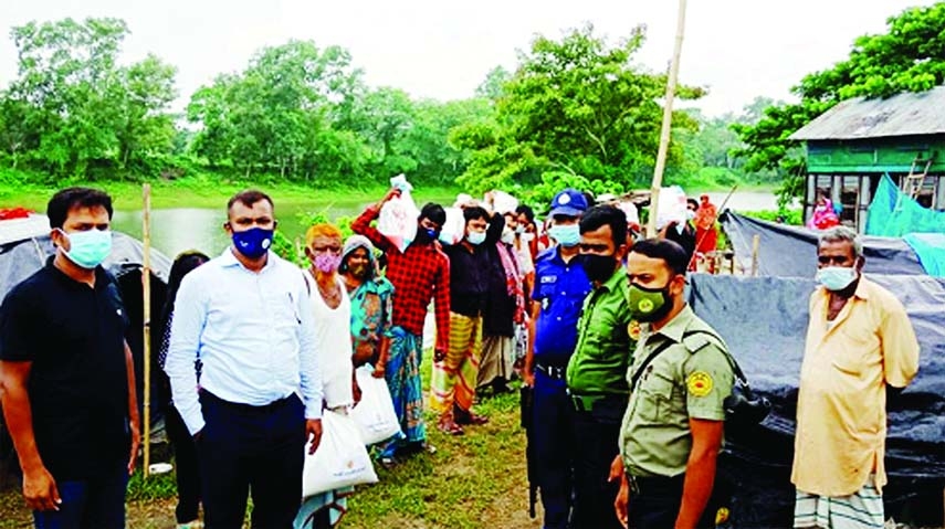 A total of 22 workless families of Bede Polli, residing on the country boats on Dhonagoda River beside Sree Rayerchar bridge area under Matlab Uttar Upazila, receive relief goods from UNO Gazi Shariful Hasan as gifts of the PM Sheikh Hasina on We