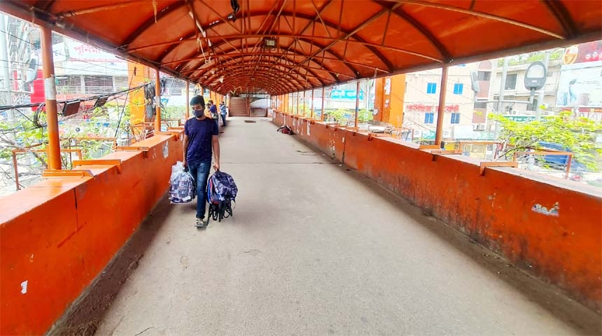 A hawker wandering with some commodities for buyers, but no buyer was seen due to lockdown. The snap was taken from under the New Market flyover on Friday.