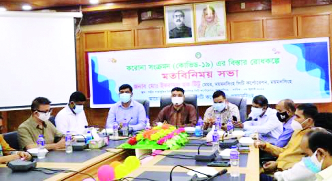 Mymensingh City Corporation Mayor Md. Ikramul Haque Titu speaks at a view exchange meeting regarding prevention of corona virus with different stakeholder at Shaheed Shahabuddin Auditorium, Mymensing on Thursday.