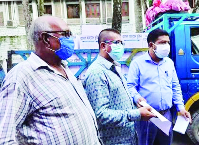 Rasel Ahamed Tohin, Director of Abdul Hamid Medical College Hospital, Kishoreganj hands over 10,200 N-95 masks, 53,000 surgical masks,700 PPEs and 400 safety goggles to Civil Surgeon Dr. Mujibur Rahman for the protection of doctors, nurses and health work